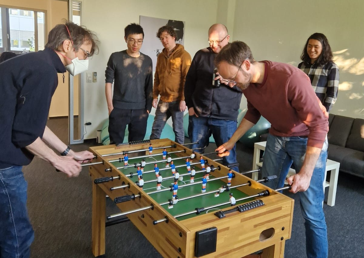 PAICON team playing foosball
